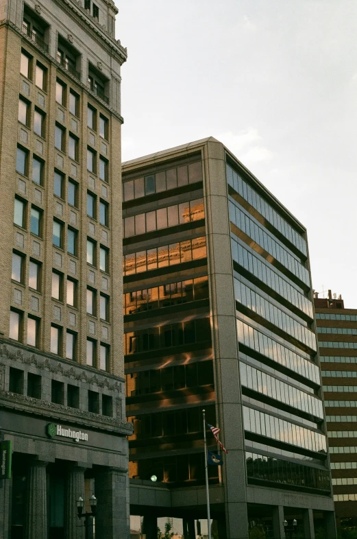 two very tall buildings next to each other in the city