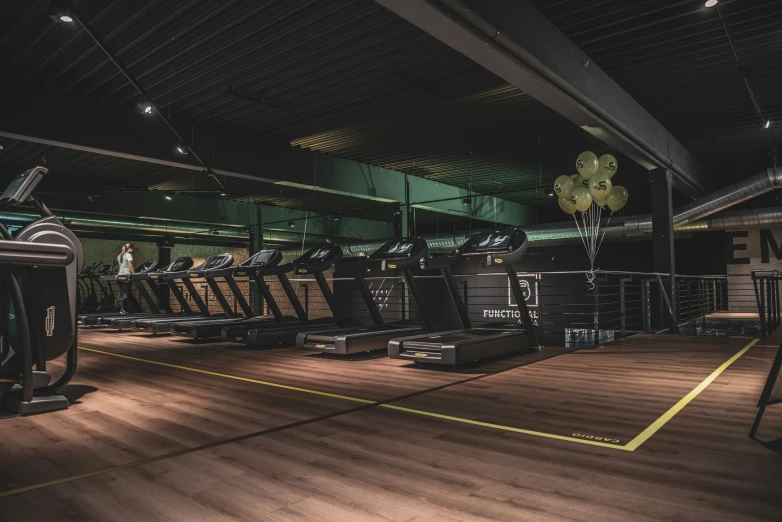 an empty gym is lit up by the lights