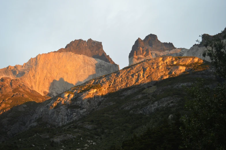 a mountain is in the background as sun goes down