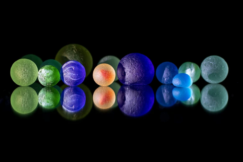 a group of eggs and three colored ones