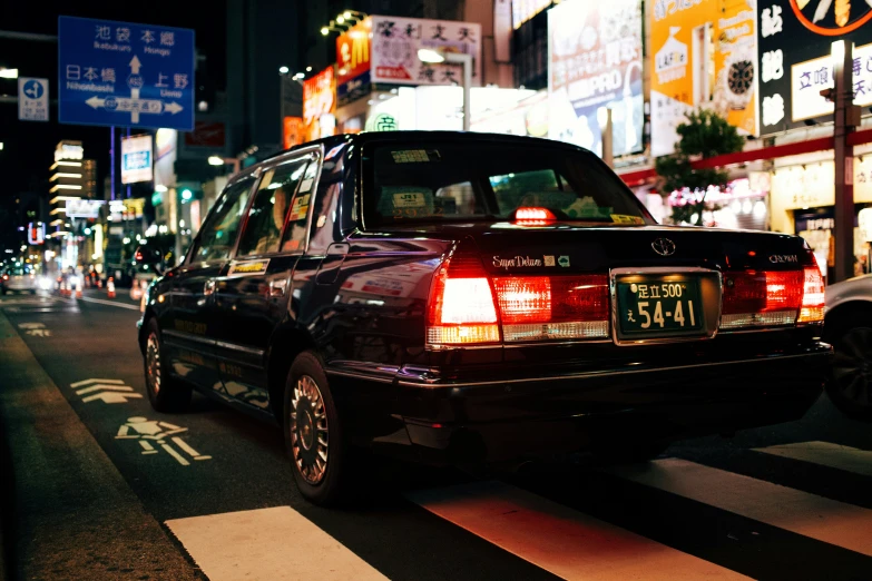 car stopped at an intersection at night time