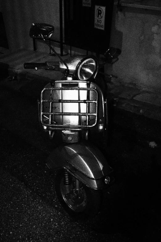 a motorcycle parked outside at night with no rider