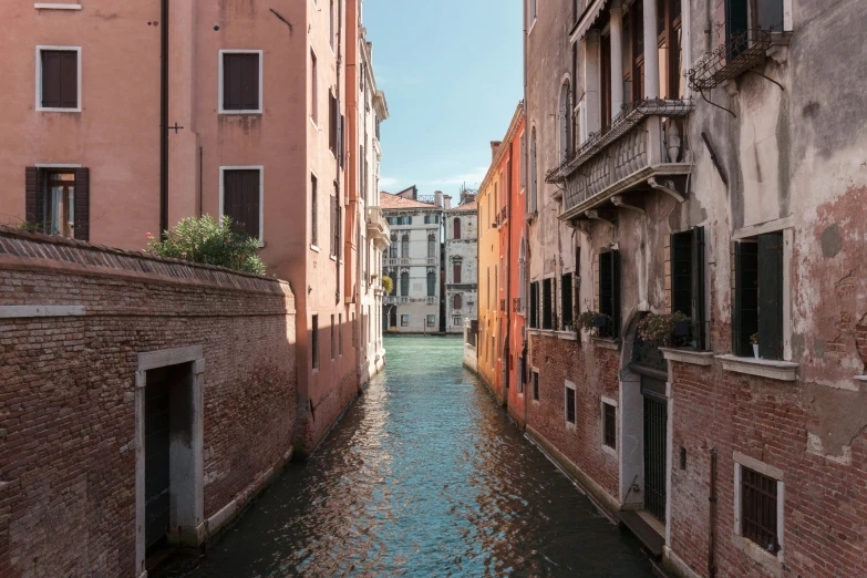 a view of some buildings and water in a canal