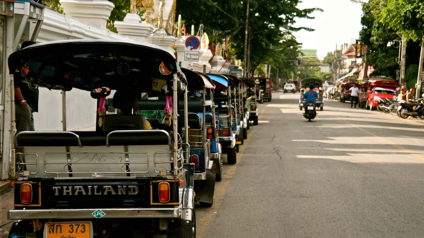 a street lined with several carts filled with luggage