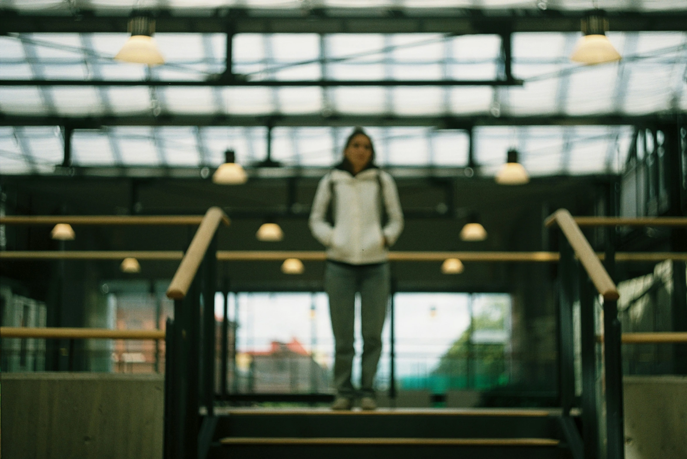 person standing near some stairs with a man standing behind them