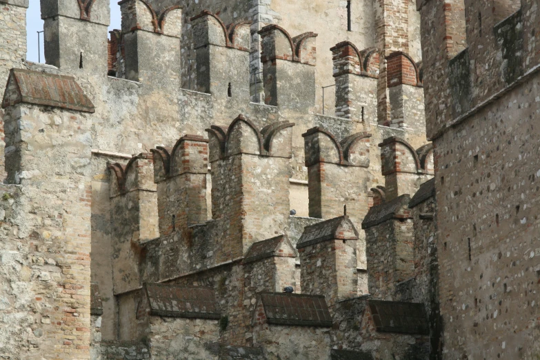 the walls of a castle and windows are dirty