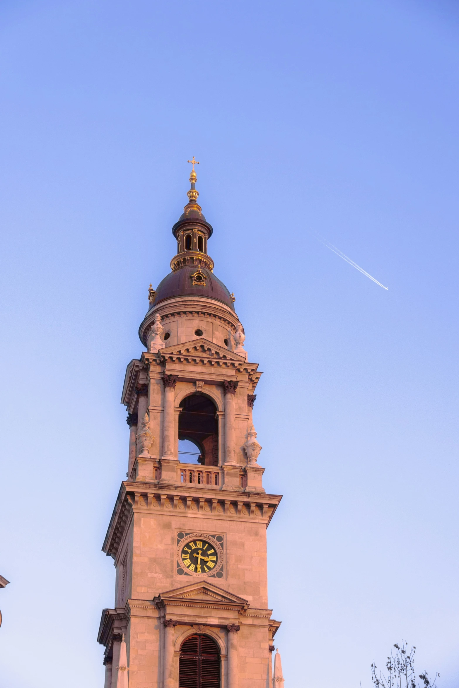 a tower with a clock inside of it on the side of a building