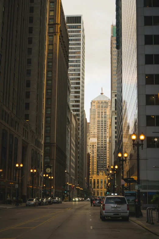 the cityscape shows multiple tall buildings and street lights