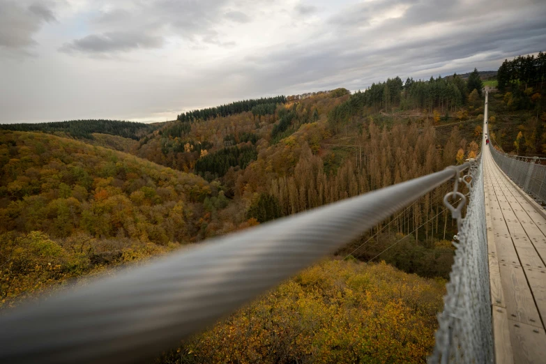 a white pipe spraying water on a hill side