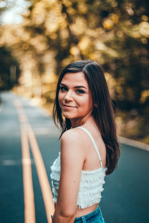 a beautiful young woman posing for a picture