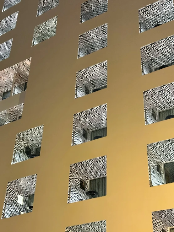 window and wall with metal grates on a tan building