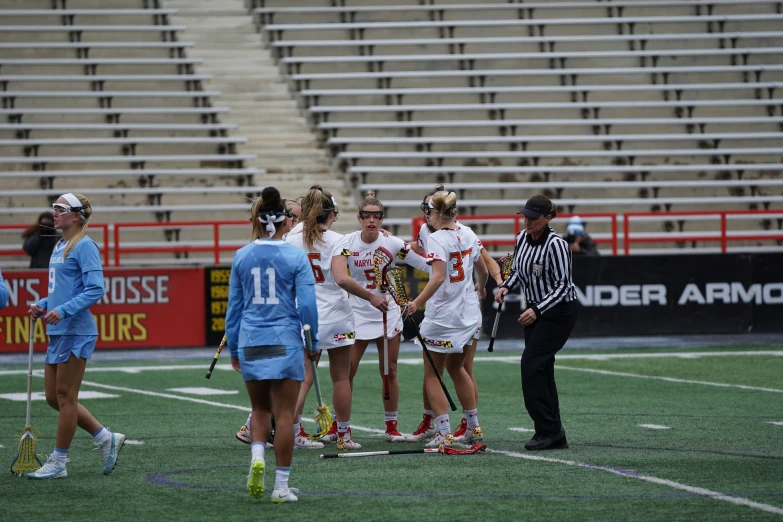 girls are standing together while they are talking