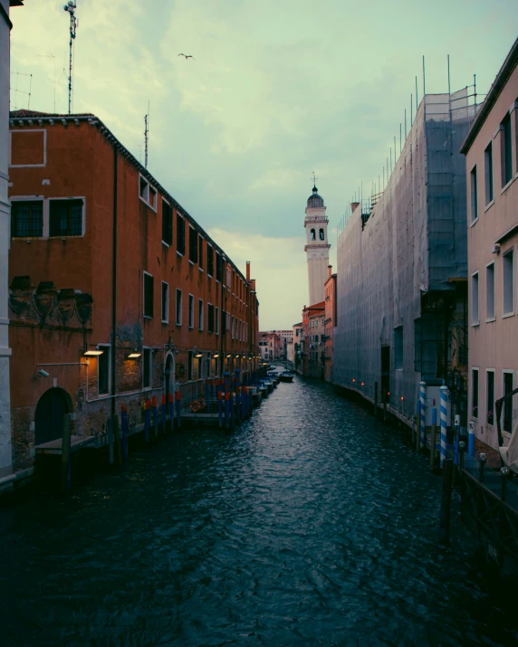 a long row of buildings sitting next to a river