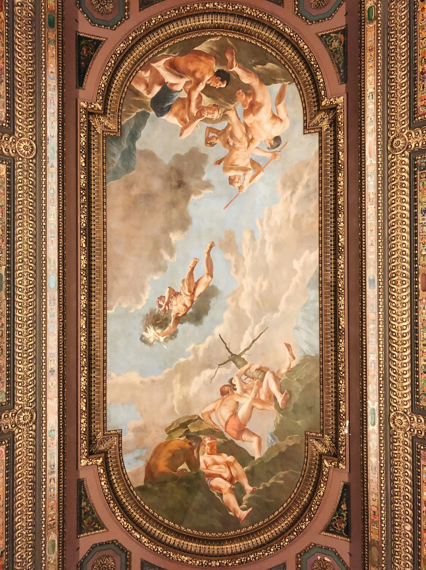 an ornate ceiling with paintings on it