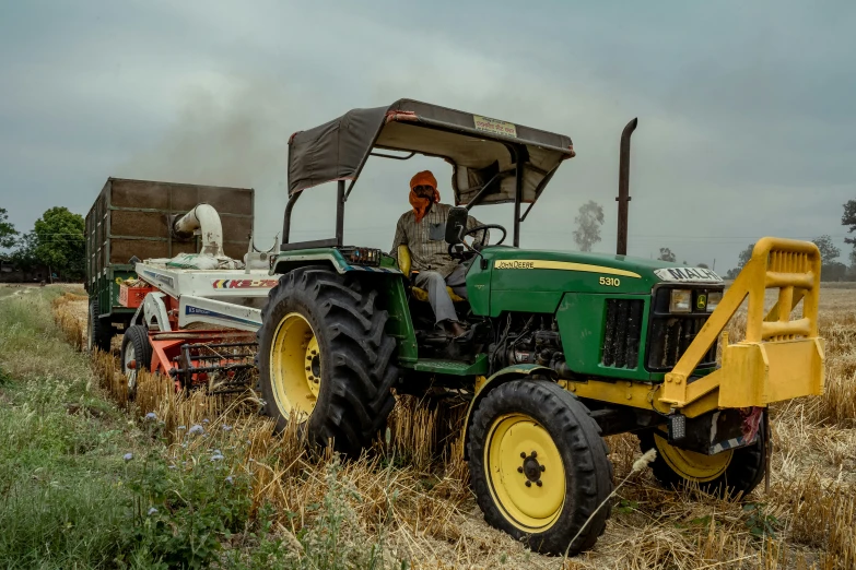 a person sits in the cab of a tractor