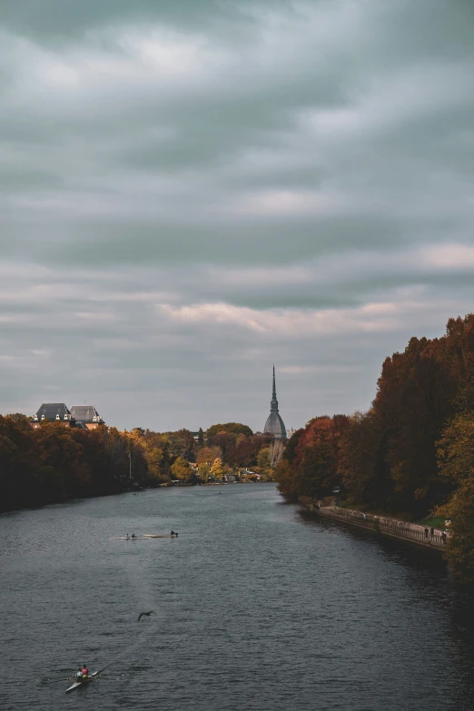 a boat floats along the river with other boats in it