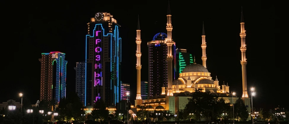 an urban area with a lot of buildings lit up