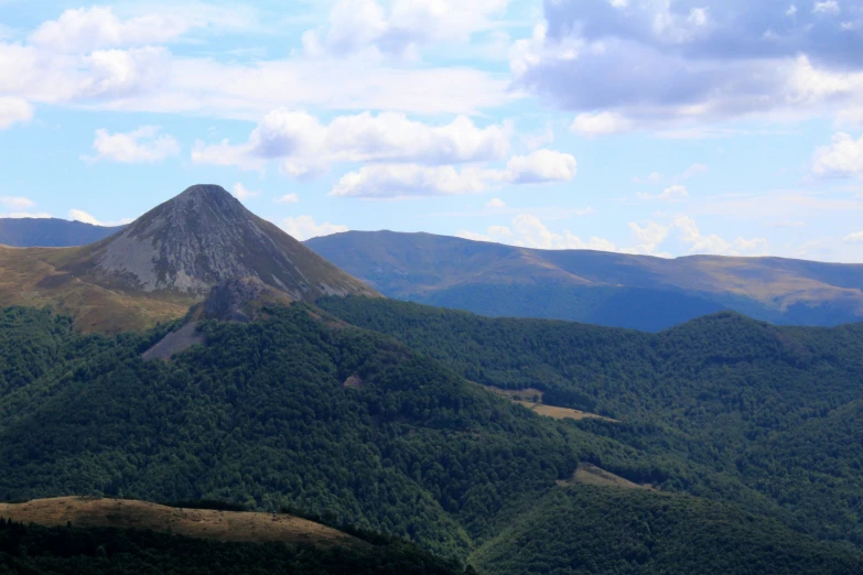 a high mountain view from top of a hill