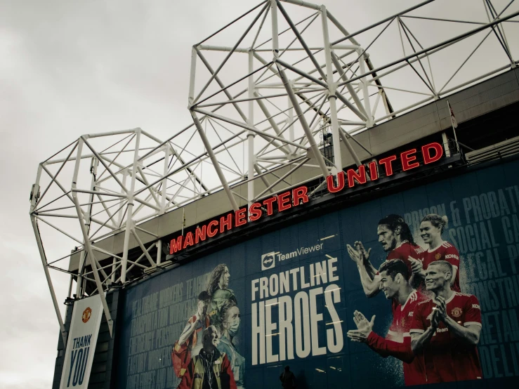 a soccer stadium with signs for the upcoming game