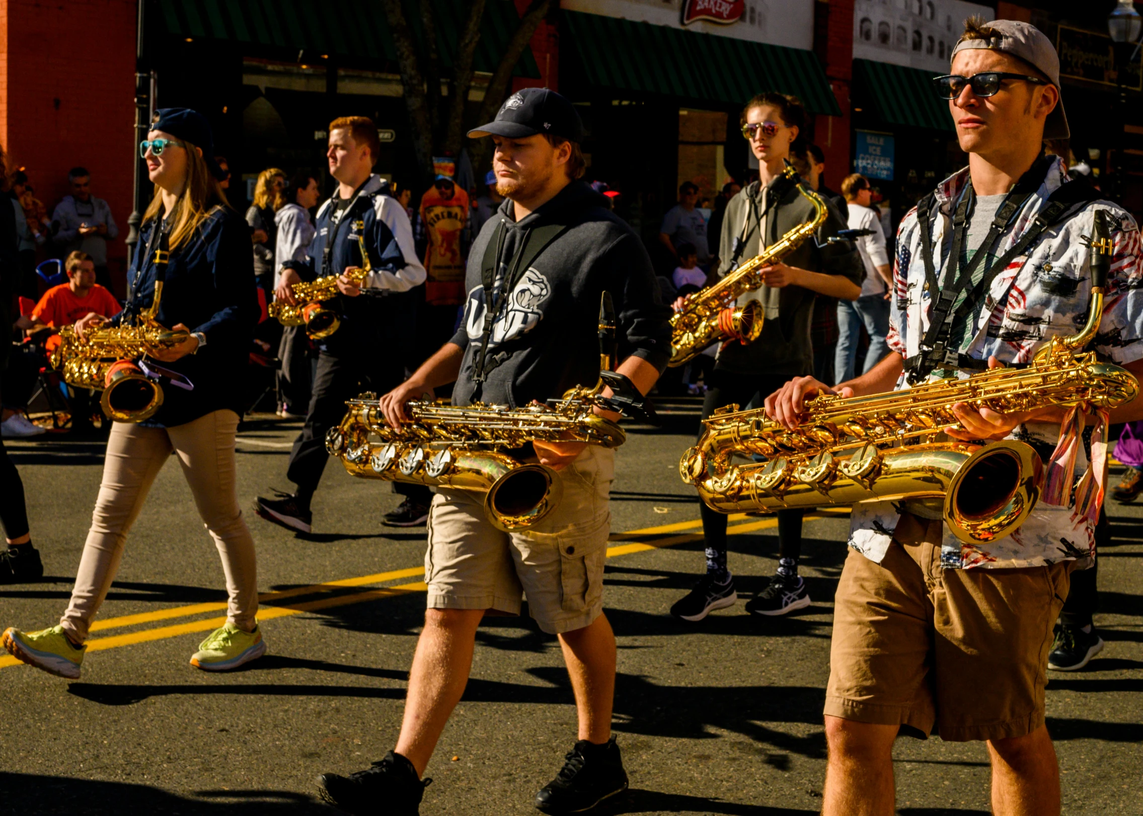 men in hats and costumes carrying ss instruments