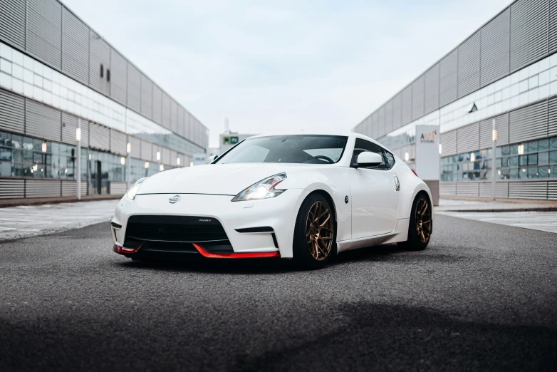 the front end of a white sports car