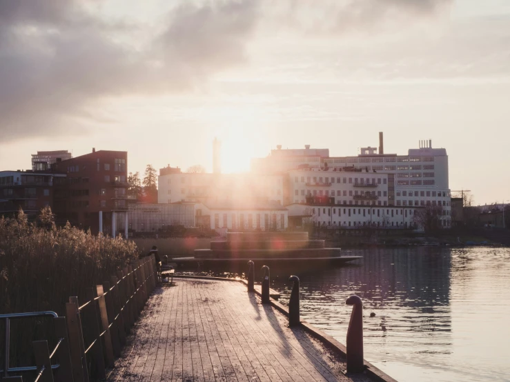 a pier on a river during the afternoon