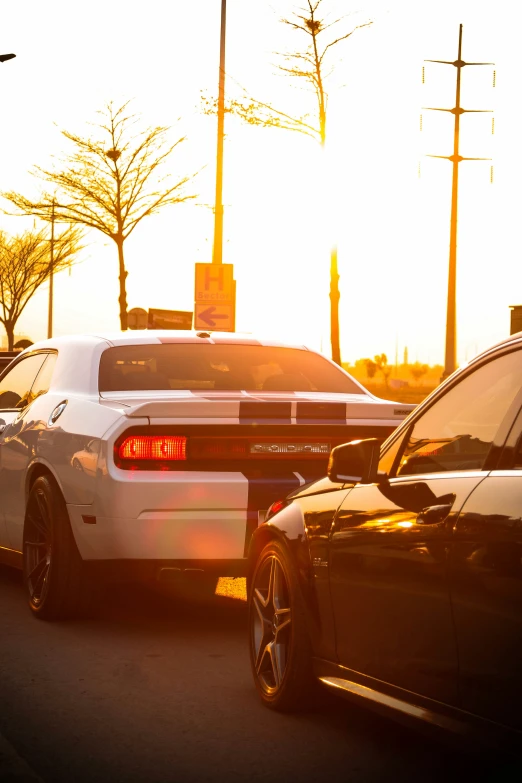 a couple of cars that are sitting in the street