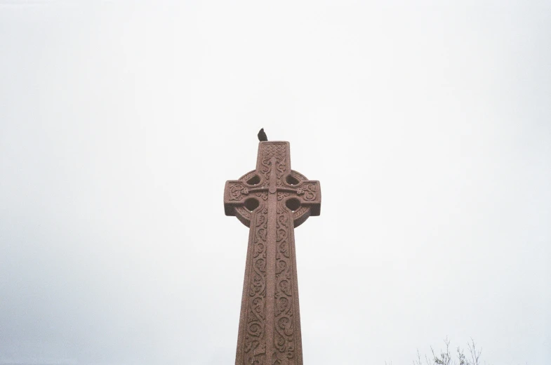 the very tall cross is painted red and gray