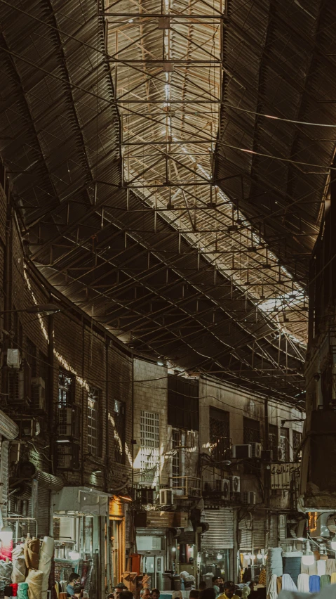 people waiting in a large open room under roof