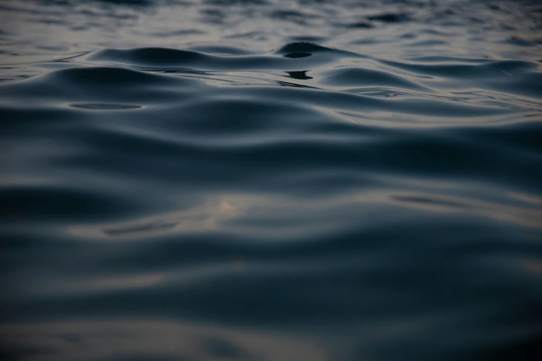 water with waves in the dark water at dusk