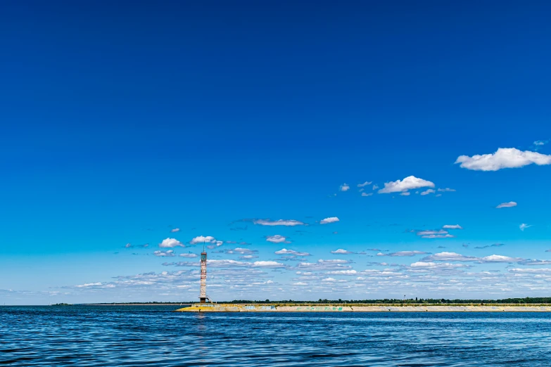 sailboats are floating on the lake on a sunny day