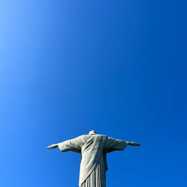 view from below of a statue of christ