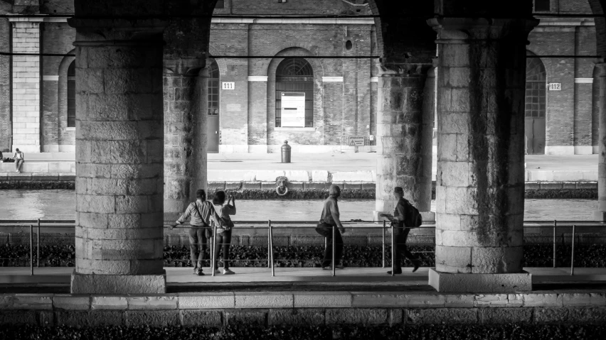 people standing at the end of a street