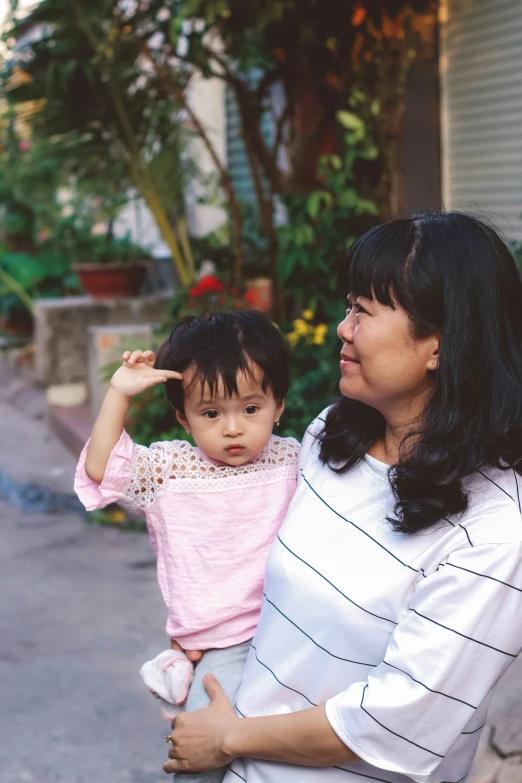 the woman and the child are pointing up