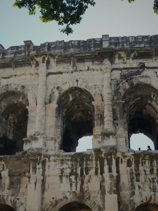 some ruins have four people sitting in them