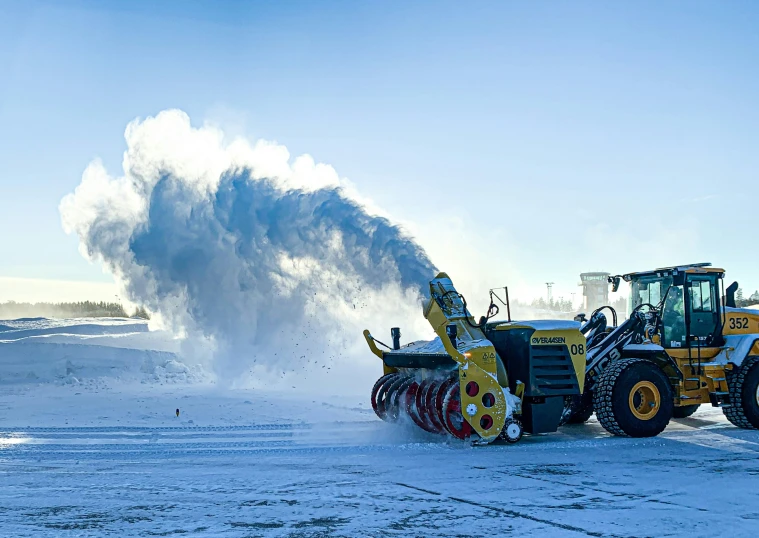 a large blow drying machine on a snowy surface