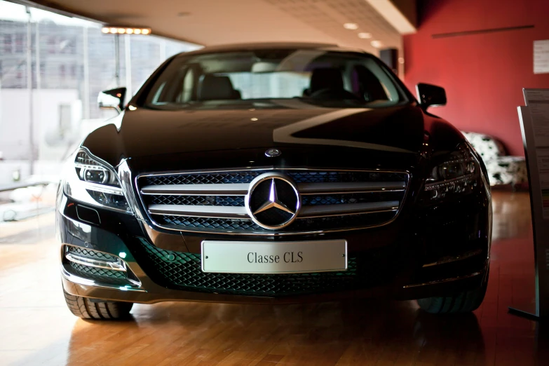 the modern mercedes car is displayed in the parking garage