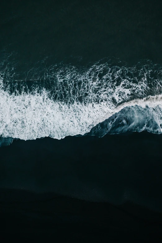 the ocean waves are coming in towards the shore