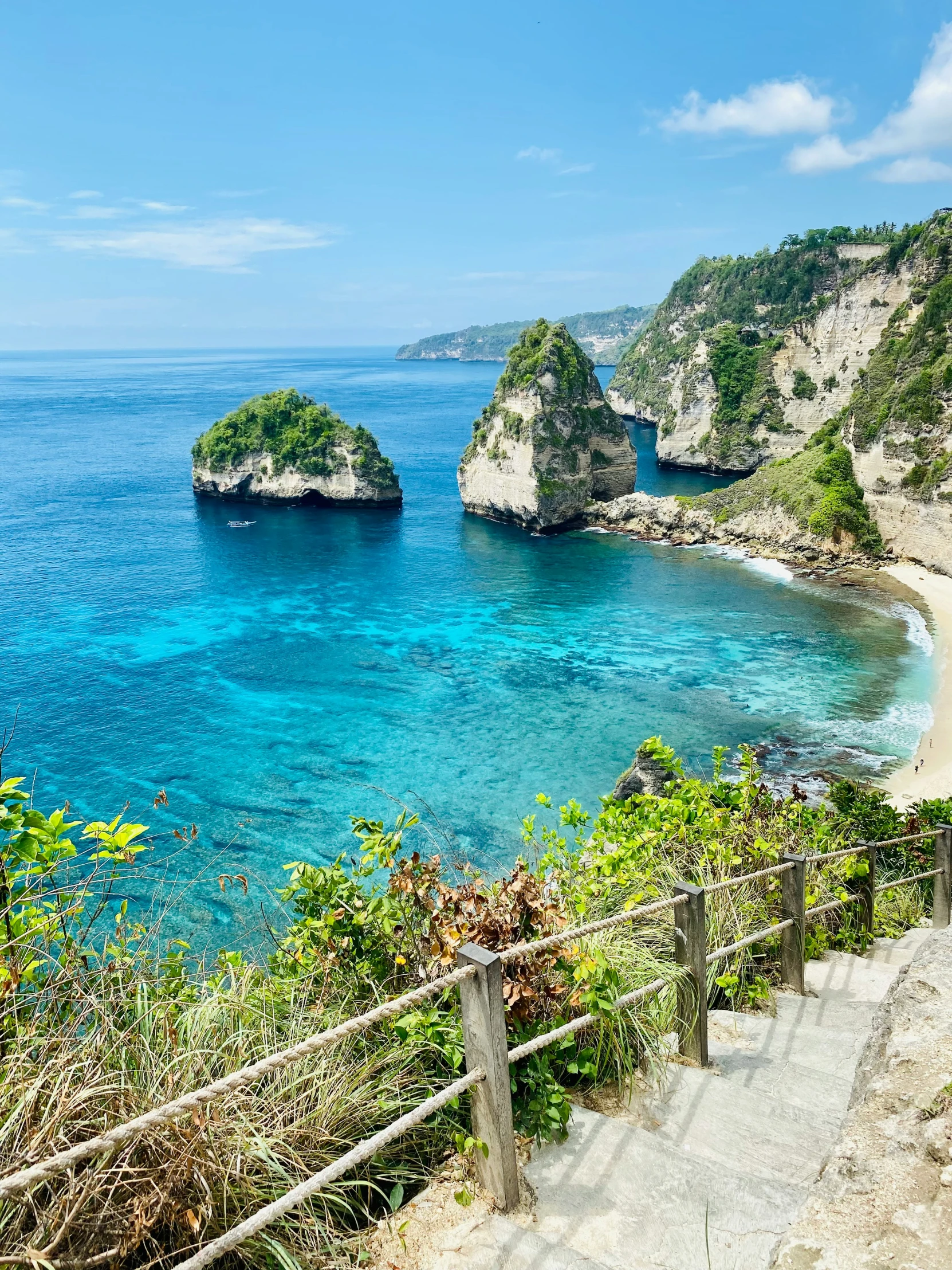 beautiful sea scene with stairs leading down to beach