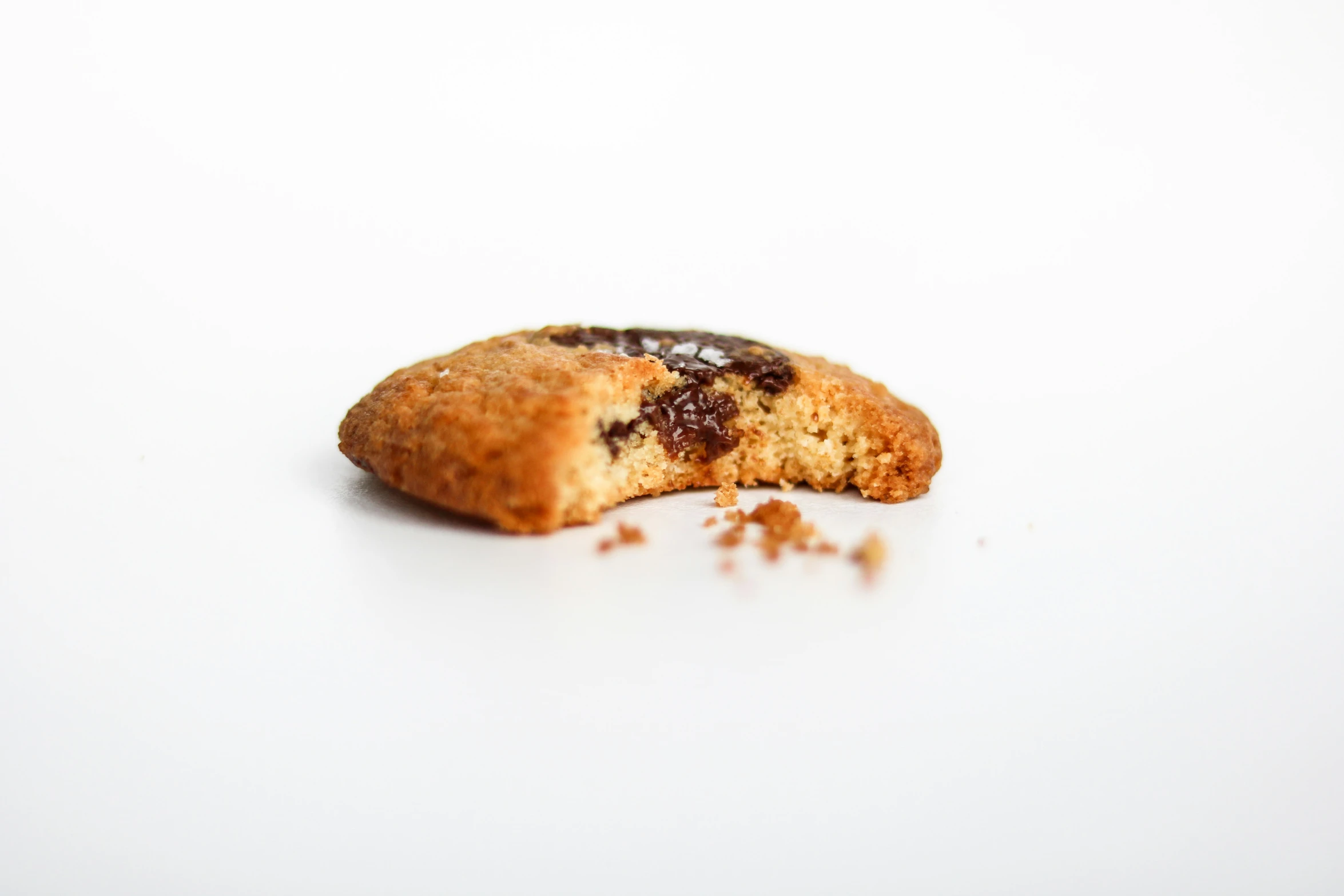 an empty cookie next to a half eaten one