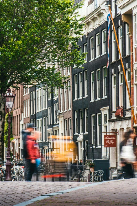 a man in red is riding a bike on the street