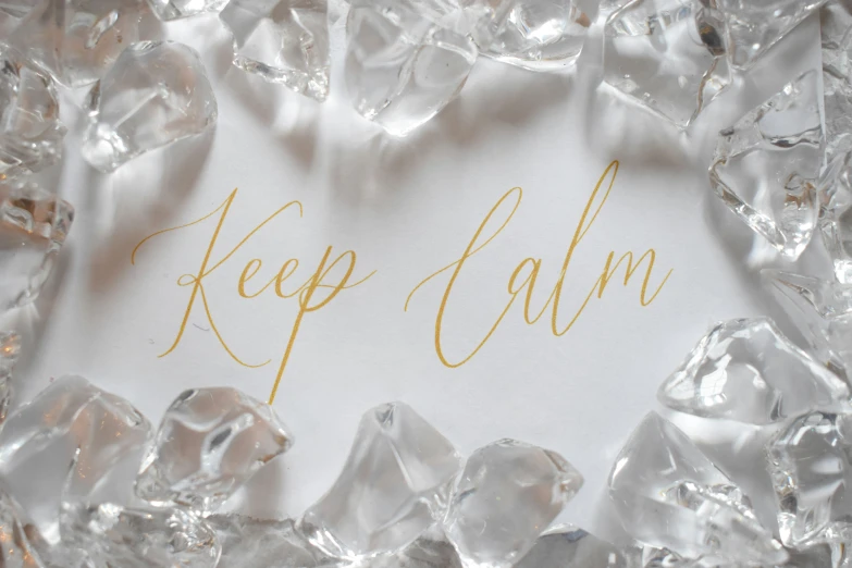 keep calm written in gold with ice shards