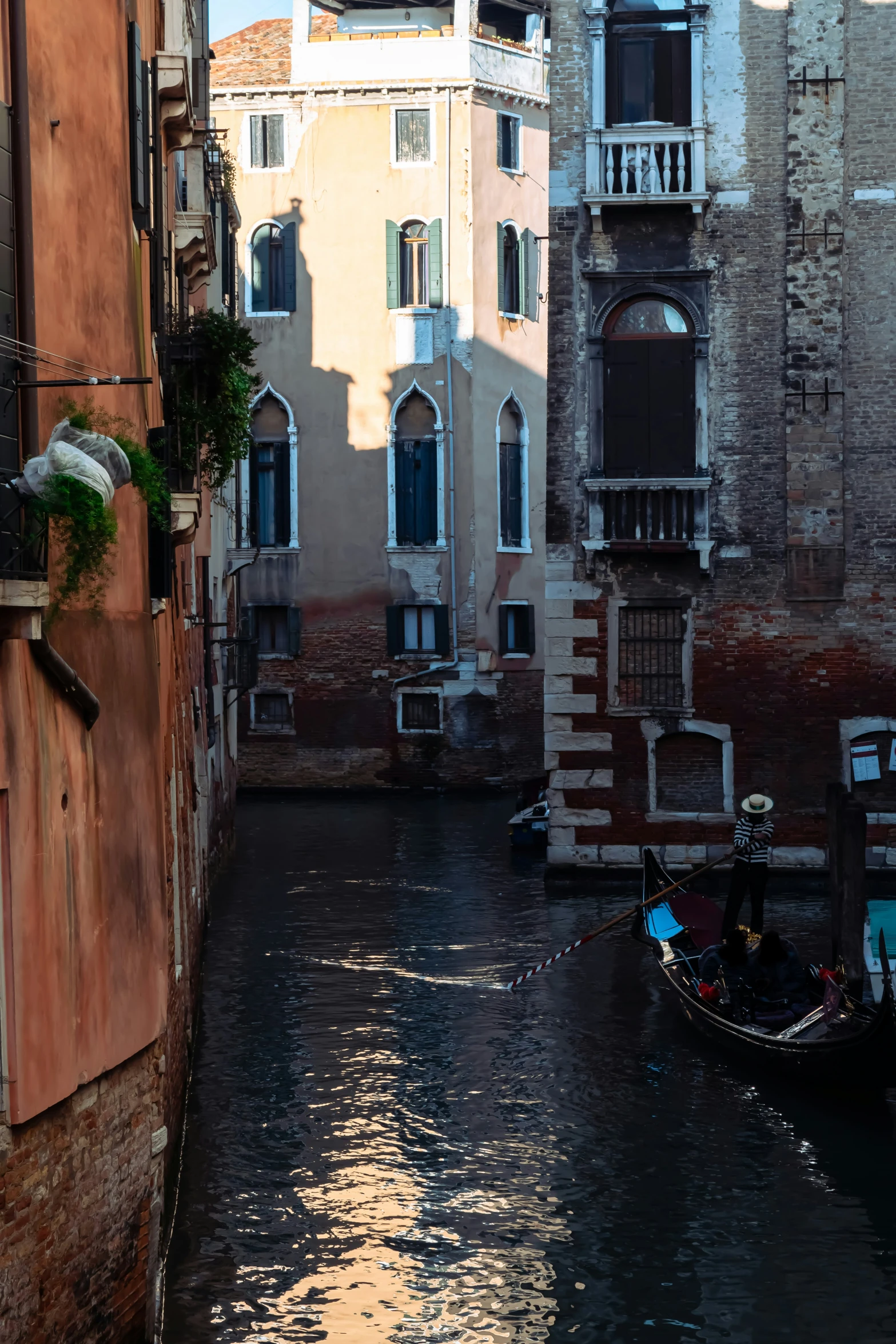 a boat on a body of water near buildings