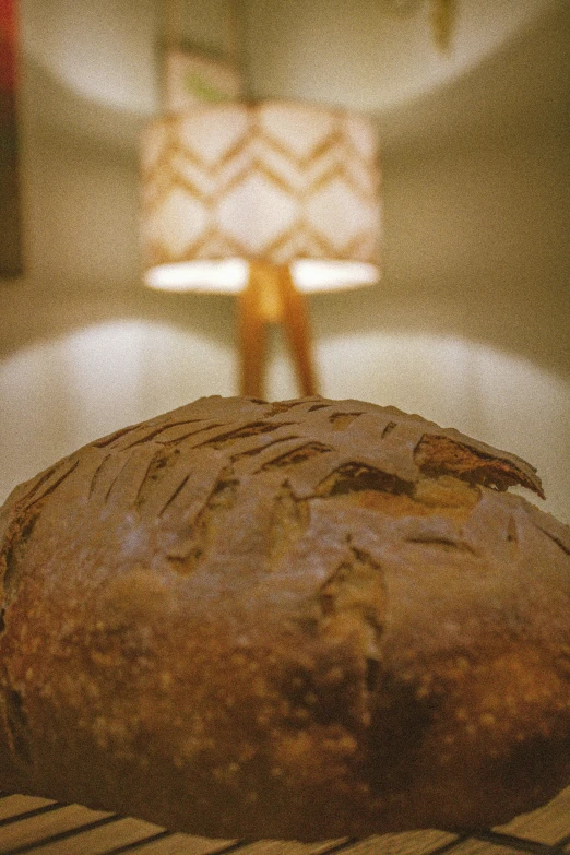 a table with some bread on it and a light