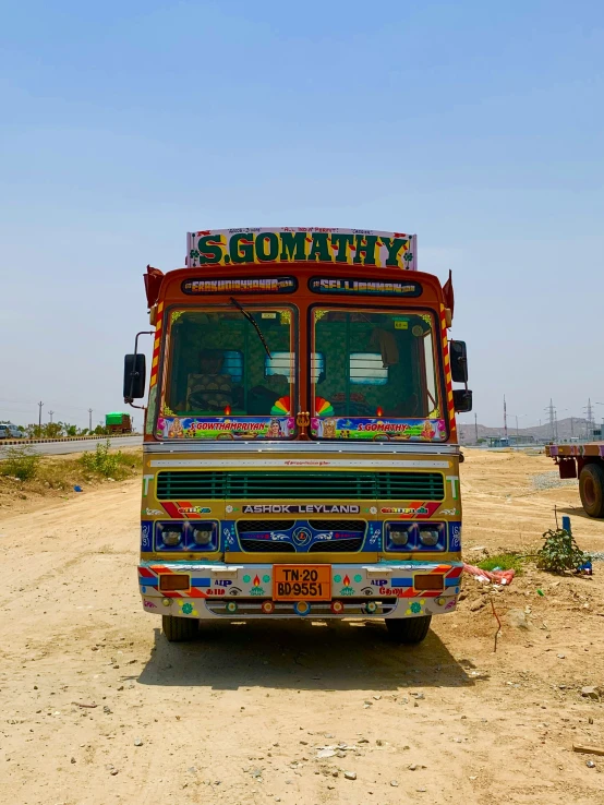 the multicolored truck has been painted in the words community