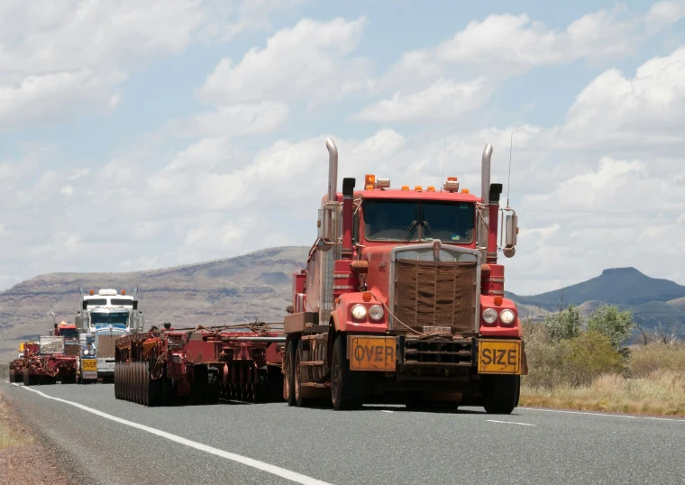 trucks are on the side of a highway