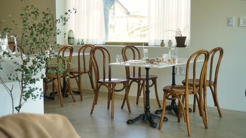 chairs and tables set up in an empty room