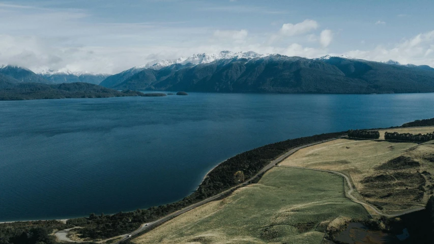 an aerial view of a mountain overlooking the ocean