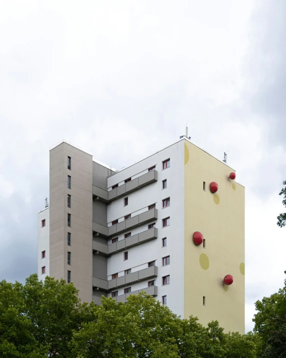 red balloons in front of an apartment building