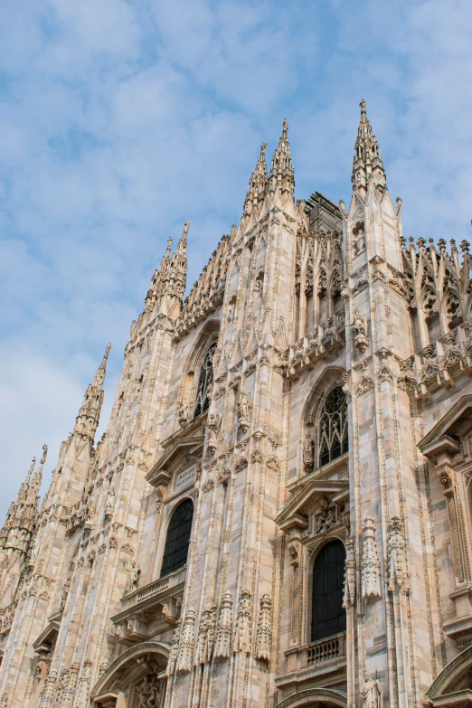 a very tall cathedral with a sky background